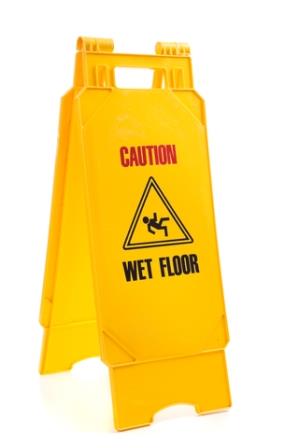 A wet floor sign to prevent slip and fall accidents in Houston Texas.