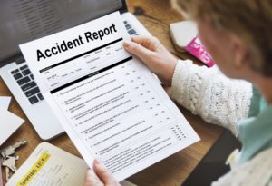 Woman reading accident report.