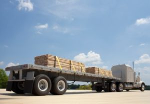 Flat bed truck in Houston with secured load