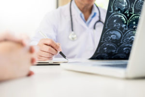 A man consults with a doctor after suffering a traumatic brain injury in Houston, Texas.