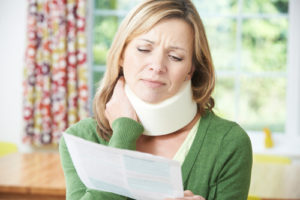 an injured woman reading her hospital bill