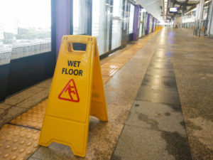 A sign to prevent slip and fall accidents in Houston Texas.