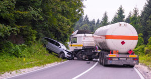 Car and truck accident happening in the nature road.