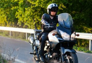 Motorcycle rider wearing safety gear.