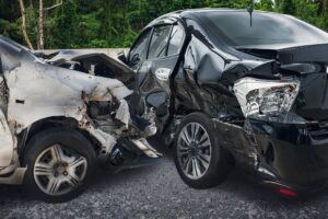 Black and silver damaged cars from car collision