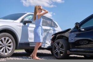 Female driver in shock involved in t-bone car accident