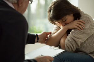 Woman feeling sad on the loss of her husband.