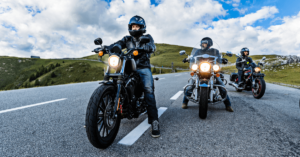 Group of motorcycle riders on mountainous highway,