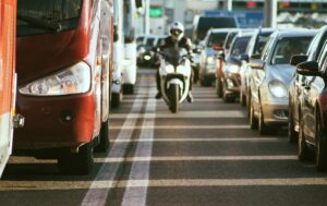 Motorcycle lane splitting in the highway.